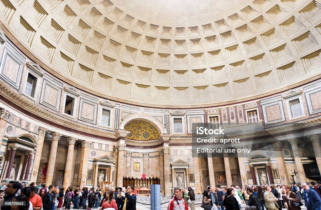 The Pantheon, Rome, Italy Rome, Italy - March 17, 2008: Several tourists in the Pantheon in Rome. The Pantheon (meaning "to every god") is a building in Rome, commissioned by Marcus Agrippa as a temple to all the gods of Ancient Rome. It was rebuilt by Emperor Hadrian around the year 126. The building is circular with a central opening to the sky on top. Almost two thousand years after it was built, it is still the world's largest unreinforced concrete dome. The height to the opening and the diameter of the interior circle are 43.3 metres (142 feet) each. Architectural Dome Stock Photo