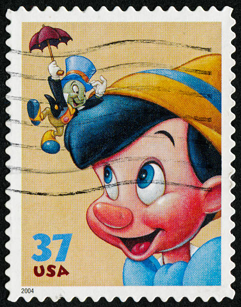 Pinocchio Stamp "Richmond, Virginia, USA - May 22nd, 2012:  Cancelled Stamp From The United States Featuring The Disney Characters Pinocchio And Jiminy Cricket." pinocchio illustrations stock illustrations