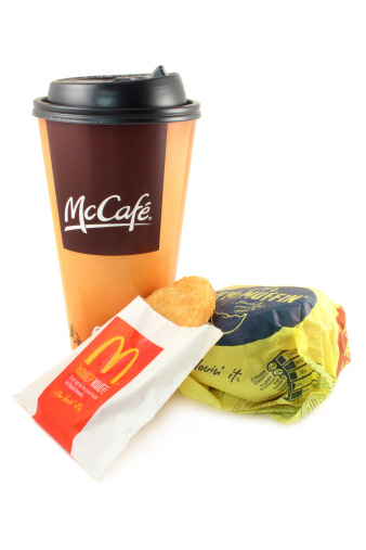 Quakertown, Pennsylvania, United States - October 22, 2011. McDonald\'s: McCafe coffee, hash brown and an egg McMuffin taken in a studio light box isolated on white. With i\'m lovin\' it slogan.