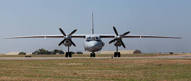 Air Show Turkey 2011 Izmir, Turkey - June 3, 2011 : A front view of a Slovakian Antonov AN - 26 standing on the runway, part of the static aircraft display in the 2011 Air Show Turkey - held in celebration of the 100th anniversary of the Turkish Air Force at the Cigli Air Base, Izmir.The Antonov An-26 (NATO reporting name: Curl) is a twin-engined turboprop military transport aircraft, designed and produced in the USSR from 12 March 1968. antonov an 26 stock pictures, royalty-free photos & images