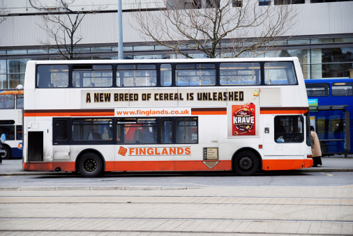 Manchester, England - April 2, 2010: Finglands bus with Kellogg's breakfast cereal Krave advert in Manchester.