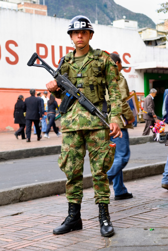 Bogota, Colombia - May 28, 2009: A Colombian soldier who is a member of the Presidential Guard stands on duty at a street corner near the Presidential Palace