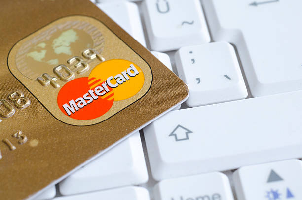 Mastercard credit cards on the keyboard stock photo