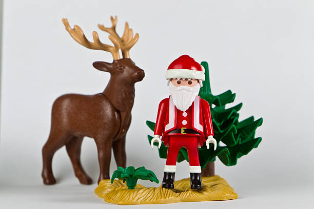 Geneva, Switzerland - November 19, 2011: Playmobil Santa Claus and a reindeer. A Playmobil children toy figure. On white background. The Playmobil toy line exists since 1975 and is produced by the german Company Brandstaetter.