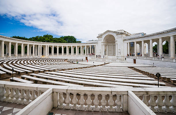 Memorial Amphitheater at Arlington National Cemetery, Virginia, USA "Arlington, Virginia, USA - May 20th. 2012 Tourist are admiring the Arlington Memorial Amphitheater at Arlington National Cemetery. The Arlington Memorial Amphitheater at Arlington National Cemetery, near the center of the Cemetery, is the home of the Tomb of the Unknowns where Unknown American Servicemembers from World War I, World War II, and Korea are interred." memorial amphitheater stock pictures, royalty-free photos & images