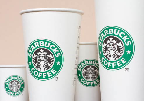 Budapest, Hungary - November 9, 2011: Starbucks Paper Coffee Cups in a row.