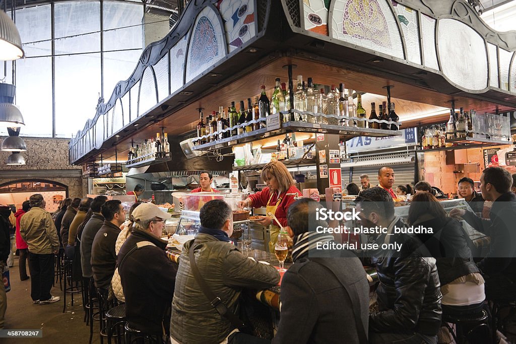 Mercat de la Boqueria Restaurant Barcelona,Spain - November, 22 2010: snack and tapas restaurant full with customers inside of Mercat de la Boqueria. Barcelona - Spain Stock Photo Mercat de la Boqueria Restaurant Barcelona,Spain - November, 22 2010: snack and tapas restaurant full with customers inside of Mercat de la Boqueria. Barcelona - Spain Stock Photo