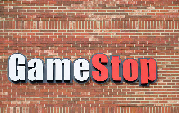 GameStop Shelby Township, Michigan, USA - November 2, 2011: The GameStop location in Shelby Township, Michigan. Tracing its roots back to Babbage's, a retailer founded in Texas in 1984, Gamestop has grown to over 6500 locations around the world and deals primarily in video games and consoles. brand name games console stock pictures, royalty-free photos & images