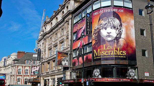 Shaftesbury Avenue. London. United Kingdom "London, United Kingdom - July 19, 2013: View from Shaftesbury Avenue of the Queen's Theater during the run of Les Miserables" soho billboard stock pictures, royalty-free photos & images