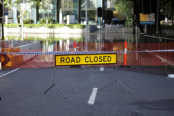 Road Closed Sign Brisbane, Australia - January 2011; Flooded road closed during the devastating Queensland floods queensland floods stock pictures, royalty-free photos & images