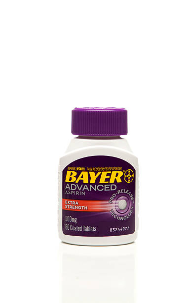 Bayer Aspirin Bottle "Lake Hopatcong, NJ USA. April 2, 2012. Studio photo of a Bayer Advanced Aspirin Bottle isolated on white. Bayer is owned by Bayer HealthCare LLC." bayer schering pharma ag photos stock pictures, royalty-free photos & images