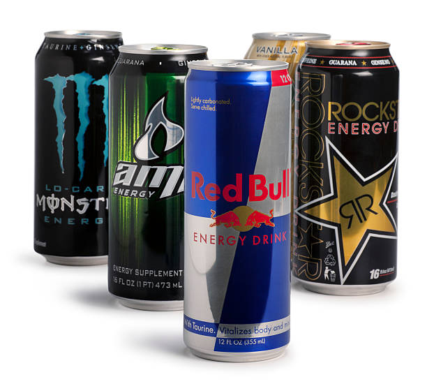 Energy Drinks San Diego, California, United States - March 6th 2011: This is a photo of 5 different energy drinks (Red Bull, Rockstar, Monster, Amp and Starbucks) in aluminum cans photographed in the studio on a white background. These energy drinks all contain caffeine which acts as a stimulant to the body. monster energy stock pictures, royalty-free photos & images