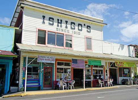 Hononmu, United States- February 2, 2012: On the big island of Hawaii, the retail stores on the main street of Honomu. This small town is on the route to the famous Akaka Falls. Hononmu was once an important hub during the years sugar cane was grown in the area.