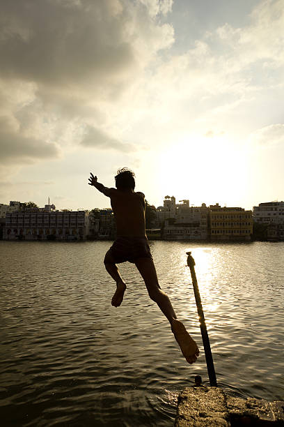 Jumping into Lake Pichola (Udaipur) stock photo