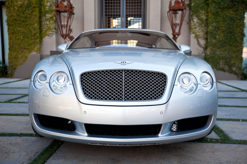 Scottsdale, Arizona, United States - December 6, 2011: A photo of a silver Bentley Continental coupe. Bentley is a luxury car company owned by Volkswagen that is based out of Chesire, England.