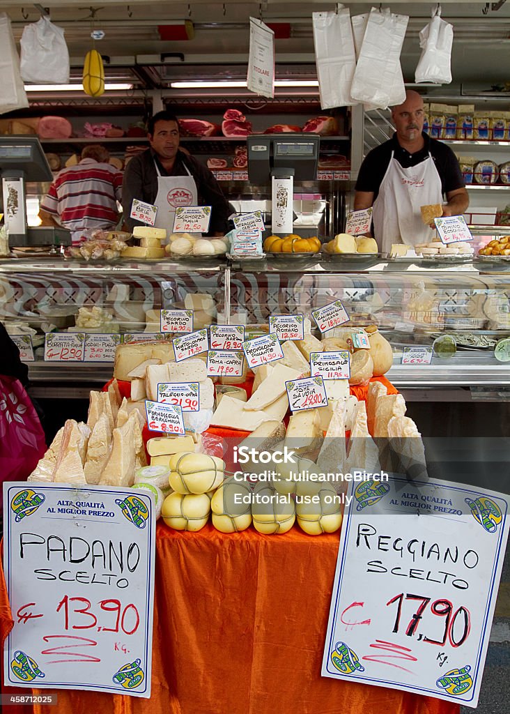 Italian cheeses Milan, Italy - September 29, 2011: Market stall in Piazza Wagner, where you can find local produce such as these cheeses &amp; hams. There is a market here every weekday from 8am - 1pm , you can buy local fruits, vegetables and organic food from bio-food producers. Cheese Stock Photo