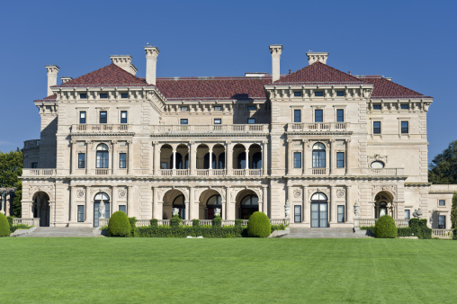 Newport, Rhode Island, USA - August, 10th 2008:  The Breakers is a grand summer cottage and a symbol of the Vanderbilt family\'s social and financial preeminence in turn of the century America. Commodore Cornelius Vanderbilt (1794-1877) established the family fortune in steamships and later in the New York Central Railroad. Image was captured from the public Cliff Walk along the ocean.