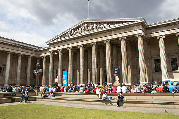 People walking next to the British Museum in the Bloomsbury area of central London, England, UK.