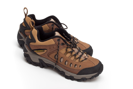 Trebnje, Slovenia, - October 30, 2011: Merrell hiking shoes.Merrell is a footwear company founded by Clark Matis, Randy Merrell, and John Schweitzer in 1981 as a maker of high-performance hiking boots. Since 1997 the company has been a wholly owned subsidiary of shoe industry giant Wolverine World Wide. The company recorded total sales of footwear and clothing totaling nearly $500 million in 2010.Studio shot.