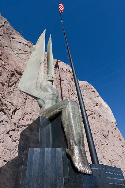 Winged Figures of the Republic Boulder City, Nevada, USA - November 17, 2008:  One of the famous sculptures of the Winged Figures of the Republic. Created by Oscar J.W. Hansen for the Hoover Dam in Nevada. hoover dam statues stock pictures, royalty-free photos & images