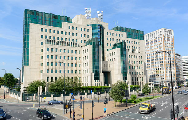 Mi6 Building "London, England, United Kingdom - September 15, 2012: Mi6 or SIS building, the office of the Secret Intelligence Service the British secret service with the people and traffic at the Vauxhall Cross road junction." mi6 stock pictures, royalty-free photos & images