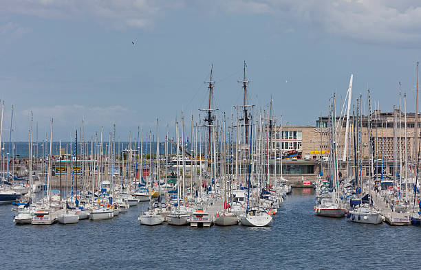 Marina in Saint-Malo, France "Saint-Malo, France - July 6, 2011: Bassin Vauban Marina in Saint-Malo, France. This marina has moorings for 200 vessels and is accessed through a lock. It is located right under the city walls of Saint-Malo." leisure activity french culture sport high angle view stock pictures, royalty-free photos & images