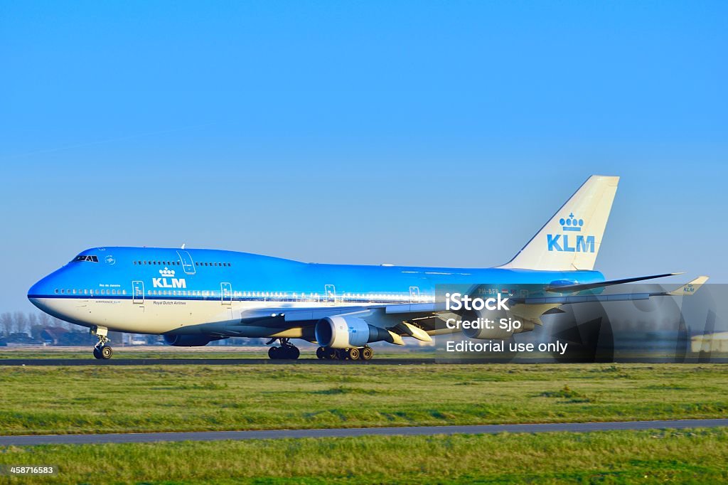 KLM Boeing 747 Schiphol, The Netherlands - November 14, 2012: KLM Royal Dutch Airlines Boeing 747-400 taking off from Schiphol Airport in The Netherlands at the end of the day. Aerospace Industry Stock Photo