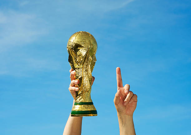 Fifa World Cup Soccer "Los Angeles, California, USA - May 12th 2010: Hands holding up a replica of the Soccer World Cup previous to South Africa\'s Tournament." international soccer event photos stock pictures, royalty-free photos & images