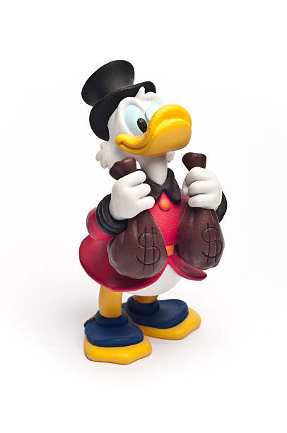Disney's Scrooge McDuck "Catania, Sicily, Italy - October 06, 2011: Studio shot of the Disney cartoon character Scrooge McDuck. This Disney toy." duck with hat stock pictures, royalty-free photos & images
