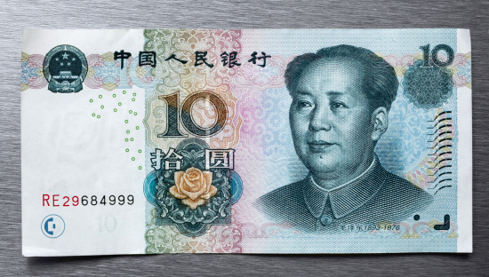 Weimar, Germany - February 16, 2011: Chinese currency, 10 yuan paper banknote has a portrait of Mao Zedong. Chinese Currency is called Renminbi (RMB or CNY) means \\\