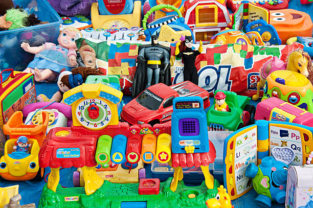 Plastic Toys "Albuquerque, USA - November 17, 2012: A pile of plastic, used toys at the flea market in Albuquerque." toy stock pictures, royalty-free photos & images