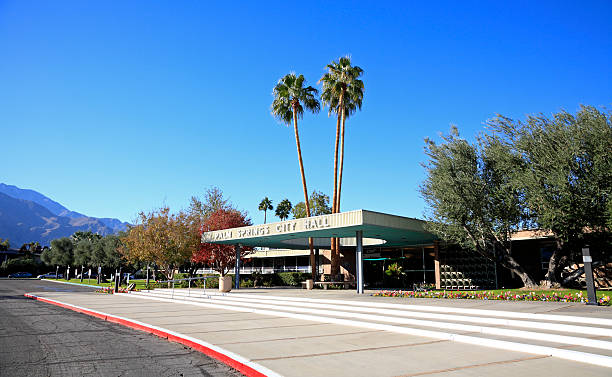 Palm Springs City Hall With San Jacinto Mountains "Palm Springs,United States- November 25,2012: Exterior front entrance of the Palm Springs City Hall. This building is a landmark for Mid Century architecture.  San Jacinto Mountains in the background." editorial architecture famous place local landmark stock pictures, royalty-free photos & images