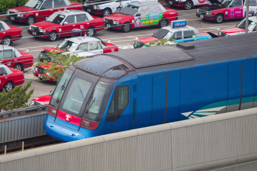 Gothenburg, Sweden - May 01 2022: Train lines running along a highway.