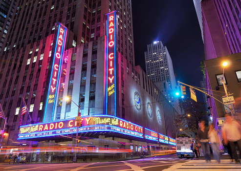 New York City, USA - May 12, 2012: Radio City Music Hall at Rockefeller Center as seen from Avenue of the Americas. Completed in 1932, the famous music hall was declared a city landmark in 1978.