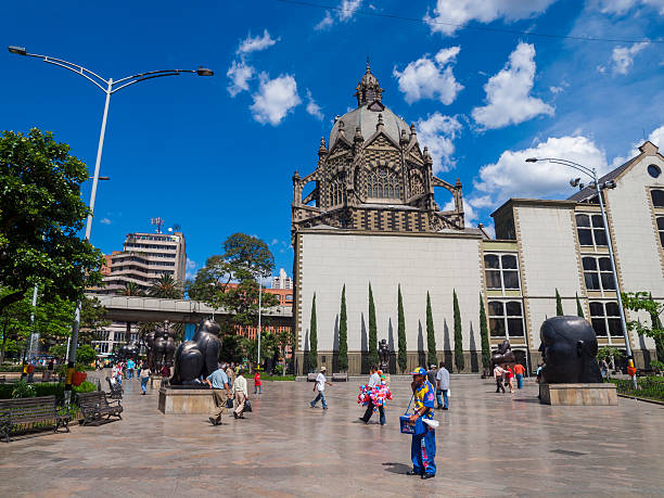 Plaza Botero, Medellin "Medellin, Colombia - April 22, 2009: Pedestrians walk through plaza Botero in the centre of Medellin in Colombia. Medellin is the second largest city in Colombia, once notorious as the base of the ""Medellin cartel"" but now considered a model for development by some due to its a liberalized development policies, improved security, and improved education." 2009 stock pictures, royalty-free photos & images