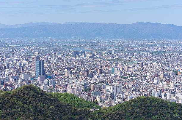 Downtown Gifu city "Gifu, Japan - April 27, 2012 : An aerial view of downtown Gifu city in Gifu prefecture, Japan.Taken from the top of Mt.Kinka." gifu prefecture stock pictures, royalty-free photos & images