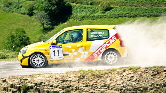 Vega de Pas, Spain - July 28, 2013: A Renault Clio rally car on a northern Spanish road during a competition.