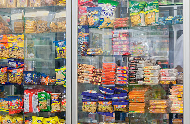 Snacks in cafeteria - University San Jose, Costa Rica "San Jose, Costa Rica - September 23, 2008: Snacks in a window display in cafeteria of university in San Jose, Costa Rica. Excessive snacking has been implicated in the increasing prevalence of obesity in Costa Rica." convenience food stock pictures, royalty-free photos & images