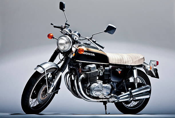 Honda CB 750 four vintage motorcycle in studio shoot "Forli, Italy - March 6, 2011: Honda CB 750 four vintage motorbike" 4 wheel motorbike stock pictures, royalty-free photos & images
