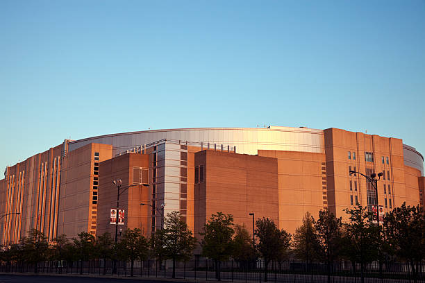 United Center "Chicago, Illinois, USA - April 6, 2012: Chicago United Center seen during spring afternoon from the parking lot. United Center was built in 1994 and holds sports and concert events. United Center is home for Chicago Bulls (NBA) Chicago Blackhawks (NHL)." blackhawk stock pictures, royalty-free photos & images