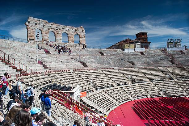 inside verona's arena "VERONA,ITALY-APRIL 26,2012:inside the arena of verona.there is the red chairs and carpets mounted for a opera shows" verona opera stock pictures, royalty-free photos & images