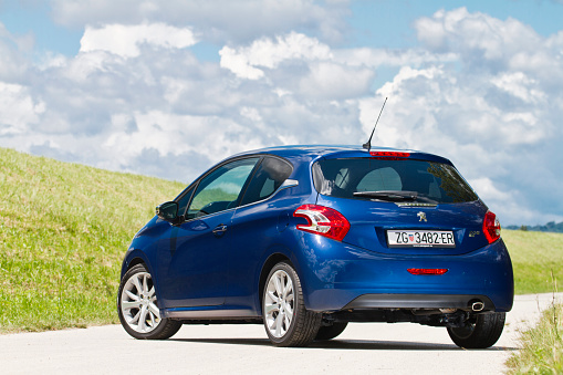 Zagreb, Croatia - June 5th, 2012: New Peugeot 208 parked on a path by the mound of river Sava. New generation of Peugeot bestseller is smaller and lighter than 207 and is a spiritual predecessor of iconic 205.