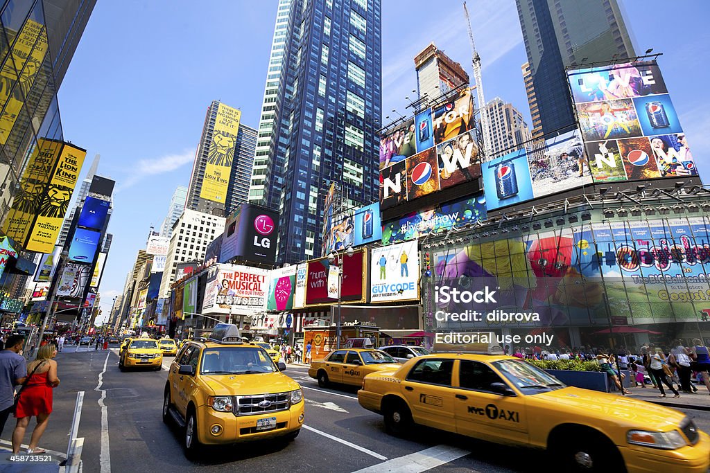 Times Square "New York, New York, USA - July 11, 2012: Yellow taxi cabs crossing Times Square with crowds of people and lots of advertising in a sunny day" New York City Stock Photo