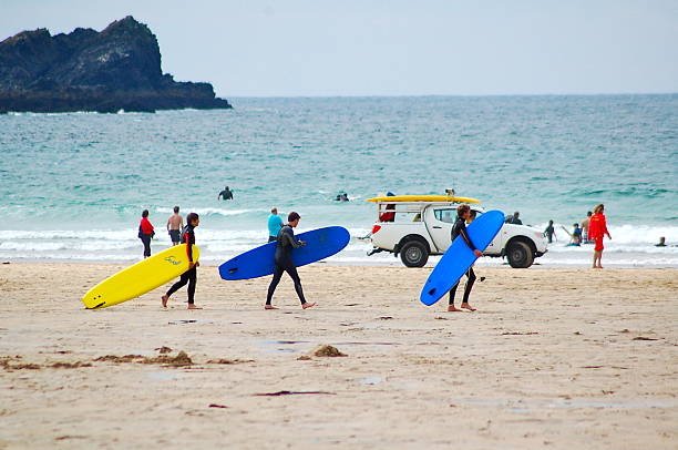 Surfing school learning taking surf lesson at the beach. Portugal