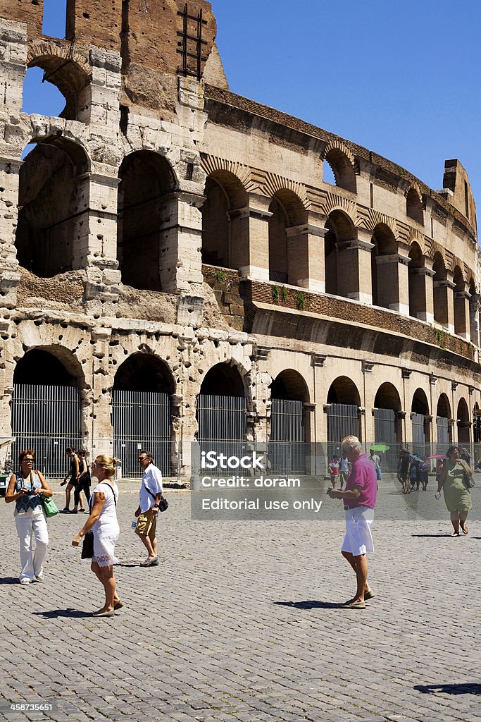 Colosseum "Rome, Italy - July 31, 2013: Tourists visiting Colosseum on cloudy day in Rome, Italy" Amphitheater Stock Photo