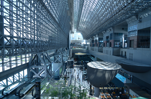 Kyoto, Japan - July 11, 2011: Kyoto station is the second largest station in Japan incorporating shopping malls, movie theaters, department stores, and a hotel.