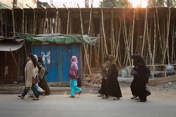 Young muslim girls going to school one morning. "Sylhet, Bangladesh - February 07, 2012: Young Muslim girls walking to school one morning." sylhet stock pictures, royalty-free photos & images