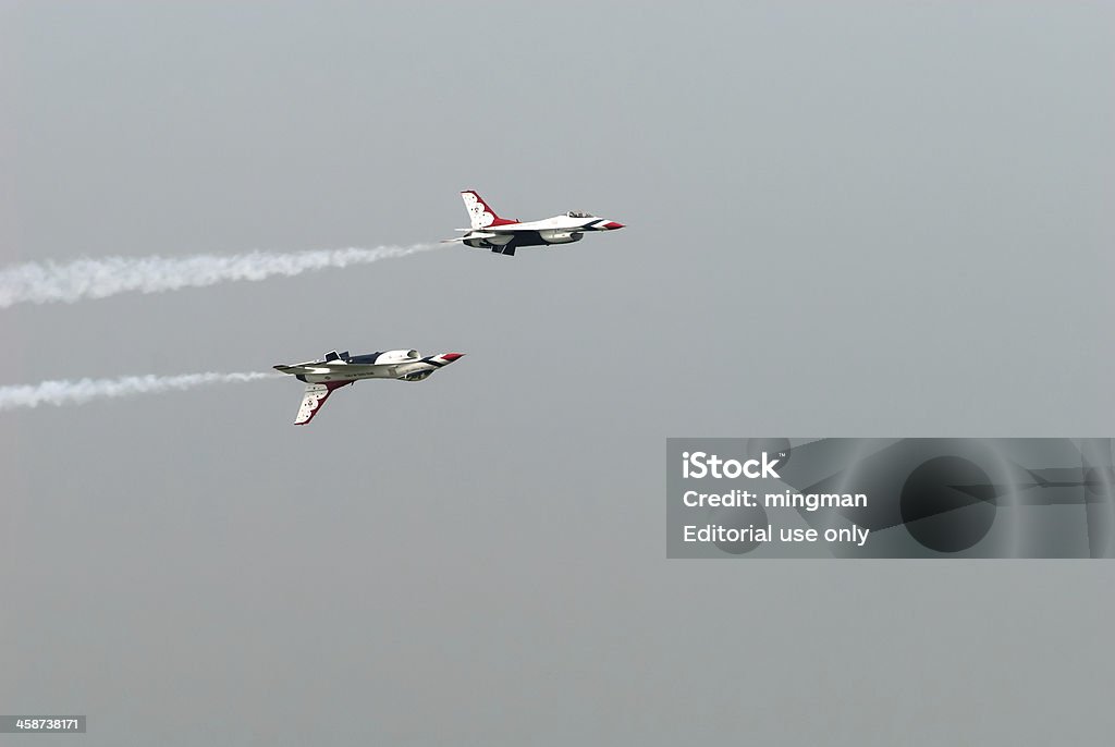 Thunderbirds (US Air Force) "Bangkok, Thailand - October 9, 2009: United States Air Force Thunderbirds official military aerobatic team during an exhibition. The squadron tours the United States and much of the world, performing aerobatic formation and solo flying in specially marked USAF jet aircraft. Cooperation between by Royal Thai Air Force with The U.S. Air Force, for a good relationship with each other for a long time. The show at Royal Thai Air Force Base, Bangkok, Thailand" Accuracy Stock Photo