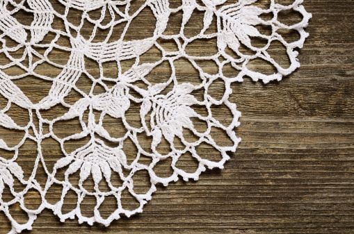 Crochet lace on an old weathered wood