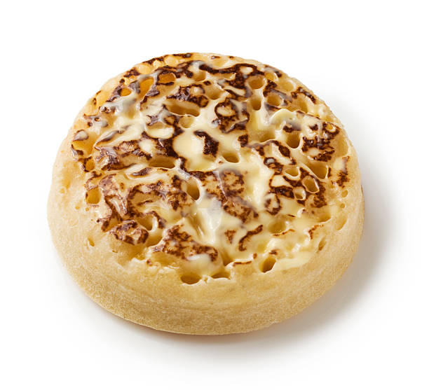 istock English crumpet with melting butter on a white background 458804813